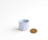 HELIOS – tealight holder in White Blue speckled 